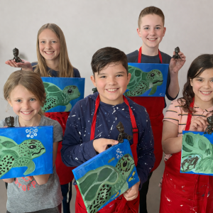 Creative kids with sea turtle paintings